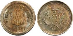 World Coins - Guatemala. 1879 wide date. 1/2 real. Gem Unc., pewter toning. Rare wide date variety.