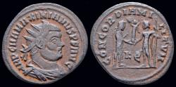 Ancient Coins - Maximianus Herculius AE radiate emperor receiving Victory on globe