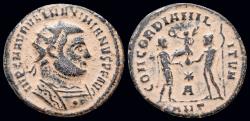 Ancient Coins - Maximianus Herculius AE radiatus Jupiter presents Victory on globe to emperor