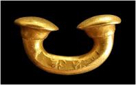 Pre-Colombian Taironal gold nose ring.