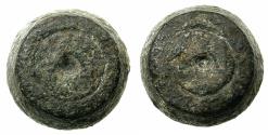 World Coins - ISLAMIC.6th-8th Cent AD. Bronze 'barrel' weight.25.61g.