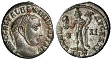 Ancient Coins - Maximinus II Daia Silvered Follis "Genius, Holding Head of Sol" Extremely Fine