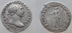 Ancient Coins - Trajan, 98-117 AD. AR Denarius. Victory advancing over Dacian shields, holding wreath and palm frond.