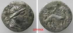 Ancient Coins - 166RK5U) YUEH CHI: Sapadbizes, ca. 20-1 BC, AR drachm (15 mm, 1.41 g), helmeted bust right, floral design on the helmet, name behind (effaced) // lion right, citing NANAIA, legends