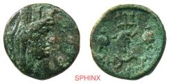 Ancient Coins - 881RC5) Ancient Greek, AE  (6.57 grms, 19.5 mm); Obverse: Head of Tyche right with mural crown. Reverse: Trident center with a breast plate armor piece mounted, dolphin at the bott