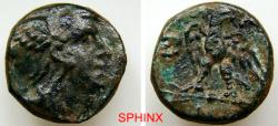 Ancient Coins - 561RG4X)  Ancient Greek, Bronze, AE 6.43 Grms, 17 mm. Obverse: Head of Herakles with lion skin headdress. Reverse: Eagle facing, head right, wings spread. FINE+.