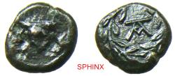 Ancient Coins - 715GR4W) RARE SICILY, Tauromenion. Campanian mercenaries. 354/3-344 BC. AE Onkia (11.5 mm, 1.57 g). Campanian helmet ornamented with griffin / Monogram within laurel wreath.
