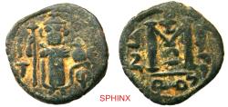 World Coins - 371HC6Z) Pre-reform issues, Arab-Byzantine. Imperial Image coinage. AE Fals (19 mm, 3.57 g, 6h). Type VI. Dimashq (Damascus) mint. Struck circa 660s-680. Standing imperial figure,