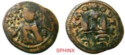 World Coins - 341HC6Z) Arab-Byzantine; Umayyad Caliphate. temp. 'Abd al-Malik ibn Marwan. AH 65-86 / AD 685-705. AE Fals. 4.12 grms, 21 mm; Imperial bust type (Type VII). Hims (Emesa) mint. Stru