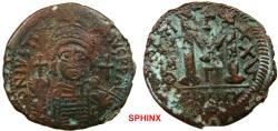Ancient Coins - 770RF19) Justinian I. 527-565. AE Follis – 40 Nummi (34 mm, 17.38 grms). Theoupolis (Antioch) mint ??, 3rd officina. Helmeted and cuirassed bust facing, holding globus cruciger and