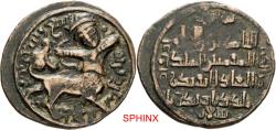 World Coins - 409RER6X) Artuqids of Mardin. Nasir al-Din Artuq Arslan. AH 597-637 / AD 1201-1239. AE Dirham (30.1mm, 10.36 g, 7h). Mardin mint. Dated AH 599 (AD 1202/3). Centaur-archer walking r