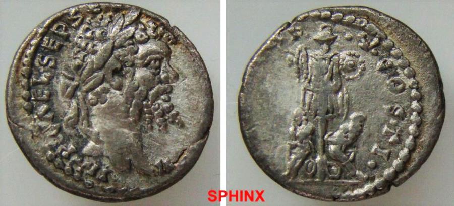Ancient Coins - 932GL17) Septimius Severus. AD 193-211. AR Denarius (17 mm, 2.06 grms). Emesa mint. Struck AD 195. Laureate head right / Two captives seated at foot of trophy. RIC IV 435; RSC 658.