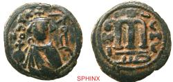 World Coins - 373HC6Z) Arab-Byzantine, Umayyad Caliphate. temp. 'Abd al-Malik ibn Marwan. AH 65-86 / AD 685-705. AE Fals (21.5 mm, 4.36 g). Imperial bust type (Type VII). Hims (Emesa) mint. Stru