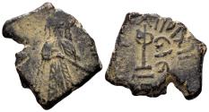 World Coins - Islamic, Umayyad Caliphate. 'Abd al-Malik ibn Marwan. AH 65-86 / 685-705 AD. AE Fals (3.14g, 18mm). Qinnasrin mint. Struck circa 690s. Foss 107