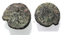 World Coins - ISLAMIC, Umayyad Caliphate. temp. 'Abd al-Malik ibn Marwan. AH 65-86 / AD 685-705. Æ Fals. Standing Caliph type. Damascus? mint. Struck circa AH 73-78 (AD 693-697)