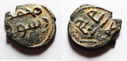 World Coins - Overstruck on an pre-reform Standing Caliph type: ISLAMIC. Umayyad Caliphate. Time of 'Abd al-Malik ibn Marwân (AH 65-86/AD 685-705). Anonymous post reform fals