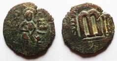 Ancient Coins - ISLAMIC. Umayyad Caliphate. Time of 'Abd al-Malik ibn Marwan (AH 65-86 / AD 685-705). AE fals (22mm, 3.94g). Yubna mint. Struck ca. AH 70-81 / AD 690-700.