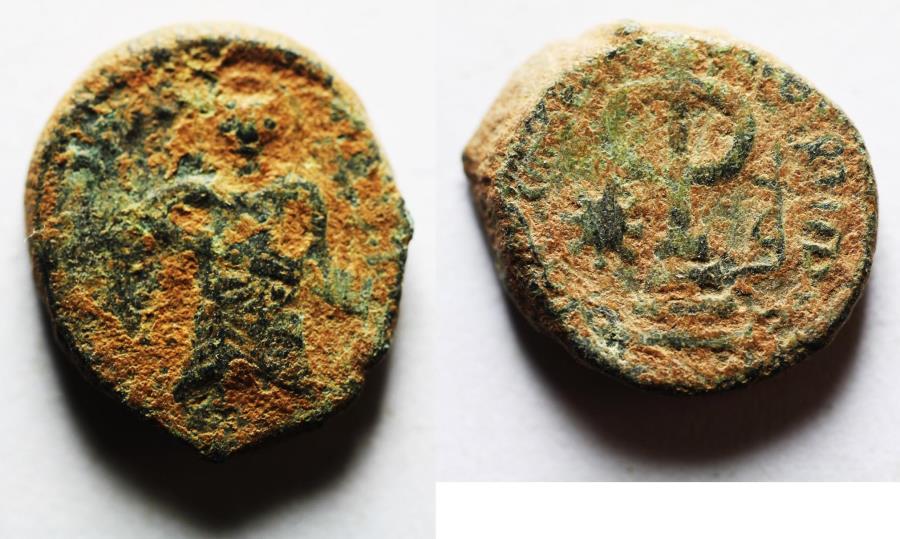 World Coins - ISLAMIC, Umayyad Caliphate. temp. 'Abd al-Malik ibn Marwan. AH 65-86 / AD 685-705. Æ Fals. Standing Caliph type. Amman mint. Struck circa AH 73-78 (AD 693-697)