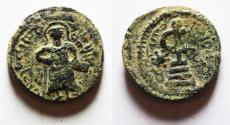 Ancient Coins - ISLAMIC, Umayyad Caliphate. temp. 'Abd al-Malik ibn Marwan. AH 65-86 / AD 685-705. Æ Fals. Standing Caliph type. Amman mint. Struck circa AH 73-78 (AD 693-697)