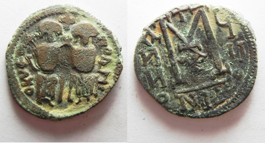 World Coins -  ISLAMIC. Umayyad Caliphate. Time of 'Abd al-Malik (AH 65-86 / AD 685-705). AE fals (25mm, 7.61g). Scythopolis (Baysan) mint.