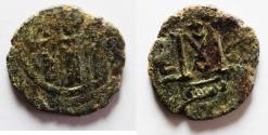 World Coins - RARE: Islamic. Umayyad Caliphate. Time of  Mu'awiya ibn Abi Sufyan (AH 41-60 /AD 661-680). AE fals (19mm, 2.87g). Probably Tabariyya (Tiberias) mint.