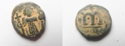 World Coins - ISLAMIC. Ummayad caliphate. Arab-Byzantine series. AE fals (18mm, 4.30g). "al-Wafa Lillah" mint. Struck c. AD 650-700. 