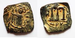 World Coins - RARE:  Islamic. Ummayad Caliphate. Time of Mu'awiya I ibn Abi Sufyan (AH 41-60 / AD 661-680).  Arab-Byzantine series. AE fals (20mm, 2.45g). ‘al-Wafa’ Lillah” mint.
