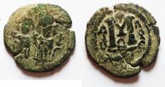World Coins - Islamic. Umayyad Caliphate.Time of 'Abd al-Malik ibn Marwan (AH 65-86 / AD 685-705). AE fals (22mm, 4.11g). Baalbek (Heliopolis) mint. Struck c. AH 65-80/ AD 685-690.