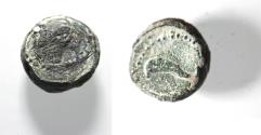 Ancient Coins - Greek. Uncertain issue. AE 8mm, 1.20g. Head of an eagle (?) r. / Dolphin swimming l.