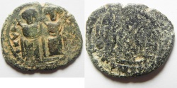 World Coins - WITH "TAYYEB" ON REV. : ISLAMIC. Ummayad caliphate. Arab-Byzantine series. AE fals (27mm, 6.47g). Baysan (Scythopolis) mint. Struck c. AD 650-700.