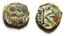 Ancient Coins - ISLAMIC Arab-Byzantine. Umayyad Caliphate. Arab-Byzantine series. AE half fals (19mm, 4.01g). Scythopolis (Baysan) mint. Struck c. AD 675-700.