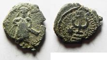 World Coins - ISLAMIC, Umayyad Caliphate. temp. 'Abd al-Malik ibn Marwan. AH 65-86 / AD 685-705. Æ Fals. Standing Caliph type. Amman mint. Struck circa AH 73-78 (AD 693-697)