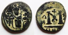 World Coins - ISLAMIC. Umayyad Caliphate. Arab-Byzantine series. Time of 'Abd al-Malik ibn Marwan (AH 65-86 / AD 685-705). AE fals . Pseudo-Dimasq mint.
