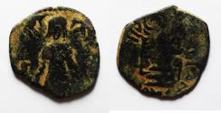 World Coins - UMAYYAD CALIPHS. Abd al-Malik. 65- 86H ( AD 685-705). AE Fals . Mint of QINNARSRIN