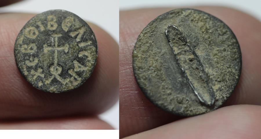 Ancient Coins - Byzantine. Bronze seal matrix (13mm). Cross surrounded by Greek legend BEΛICAPXEBΘI. 1000 A.D