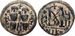 World Coins - EARLY ISLAMIC, Arab-Byzantine. In the style of Justin II. After 641 AD. 