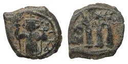 World Coins - Ummayad Caliphate. Arab-Byzantine coinage (Standing Emperor type). Circa 680s. Æ Fals