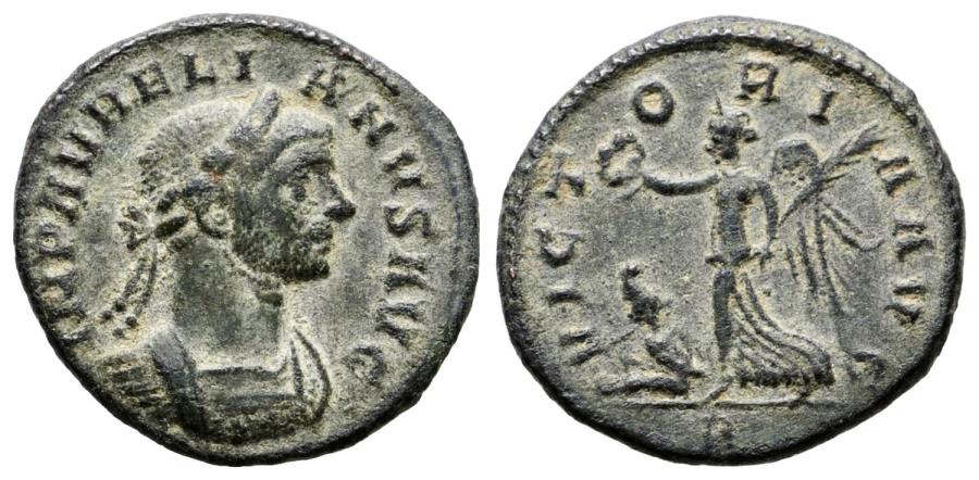 Ancient Coins - AURELIAN. Ae, Denarius. AD 275. Rome. Victory advancing left, holding wreath and palm; to left below, captive seated left A.