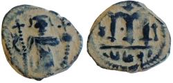 Ancient Coins - ISLAMIC. Ummayad caliphate. Arab-Byzantine series. AE fals (18.5 mm, 4.2 g). al-Wafa Lillah mint. Struck c. AD 650-700