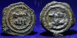 World Coins - UMAYYAD: Anonymous, ca. 700-750, AE 1/60 dirham, 1.10gm, 14mm, RR