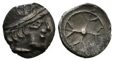Ancient Coins - GALIA, Massalia. Obolo de imitación massatolia. (Ar. 0,62g/10mm). 450-410 a.C. (BN 524). Anv: Cabeza con casco a derecha. Rev: Rueda de cuatro radios. MBC+.