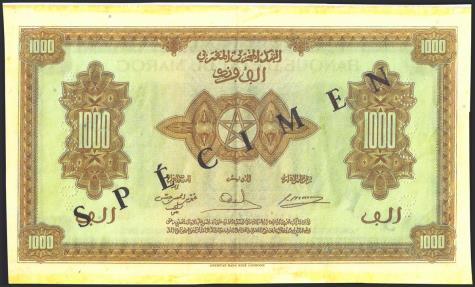 World Coins - MOROCCO. 1000 Francs. 1 May 1943. SPECIMEN and perforated *00000*. (Pick: 28s). Spots rust and paper defects, mounted. Fine.