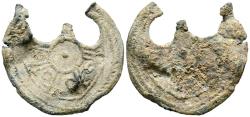 World Coins - CRONOLOGÍA INCIERTA. Amuleto monetiforme. (Pb. 2,71g/24x22mm). Aparentemente igual en anverso y reverso. Tres círculos concéntricos; en el exterior una cenefa de pequeñas líneas d