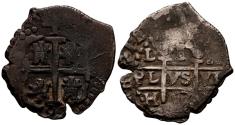 World Coins - CARLOS II (1665-1700). 1 Real. (Ar. 3,37g/21mm). 1697. Lima H. (Cal-2019-229). Doble fecha y ensayador visible. MBC+. Pátina oscura.