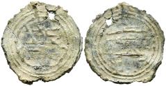 World Coins - PERIODO CALIFAL O POSTERIOR. Amuleto monetiforme. (Pb. 3,88g/24x26mm). Posiblemente Siglo X-XI. En ambas áreas, una cuádruple gráfila lineal decreciente. En el centro del anverso