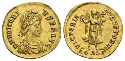 World Coins - HONORIO. Tremisis. (Au. 1,31g/14mm). 408-420 d.C. Constantinopla. Anv: D N HONORIVS P F AVG. Busto diademado, drapeado y con coraza a derecha de Honorio. Rev: VICTORIA AVGVSTORVM.