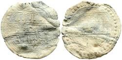 World Coins - PERIODO CALIFAL. Amuleto monetiforme. (Pb. 3,67g/27mm). Posiblemente Siglo X. En ambas áreas, tres líneas de escritura en cúfico lineal, con las astas de las letras largas acabada