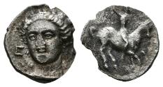 Ancient Coins - EMPORION (Ampurias, Girona). Mite. (Ar. 0.51g/10mm). 5th century BC (ca.). (FAB-1084). Obv: Female head slightly left, between EM. Rev: Rider with chlamys right. Good Very Fine. M