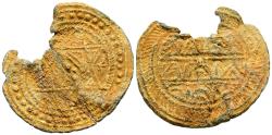 World Coins - PERIODO CALIFAL. Amuleto monetiforme. (Pb. 1,97g/23x20mm). Posiblemente Siglo X. Anv: Rodeado por una gráfila de puntos, estrella de seis puntas o sello de Salomón ornamentada. Re