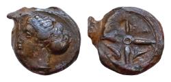 Ancient Coins - Sicily, Syracuse Æ 15mm 4,3g Hemilitron. Dionysios I, circa 405-367 BC. Head of Arethusa hair wrapped in sphendone at back of neck / Wheel of four spokes in upper two Dolphins
